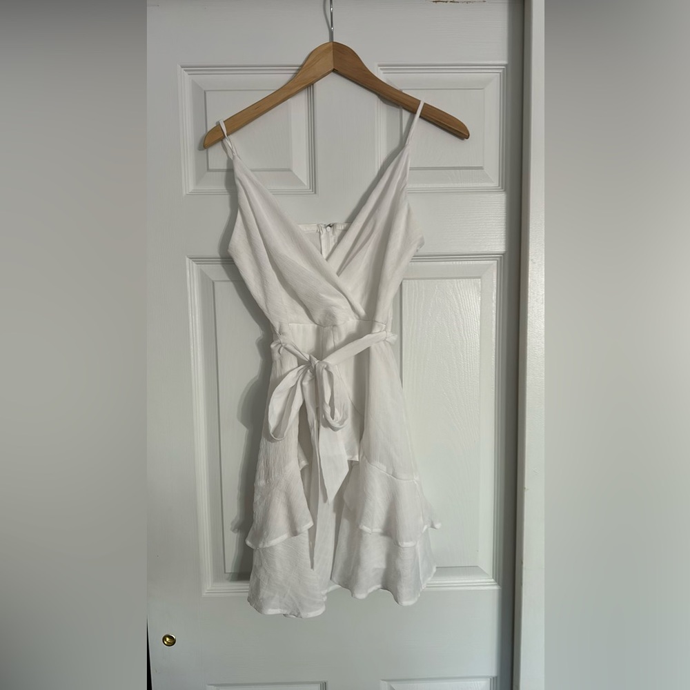 white ruffled V-neck dress